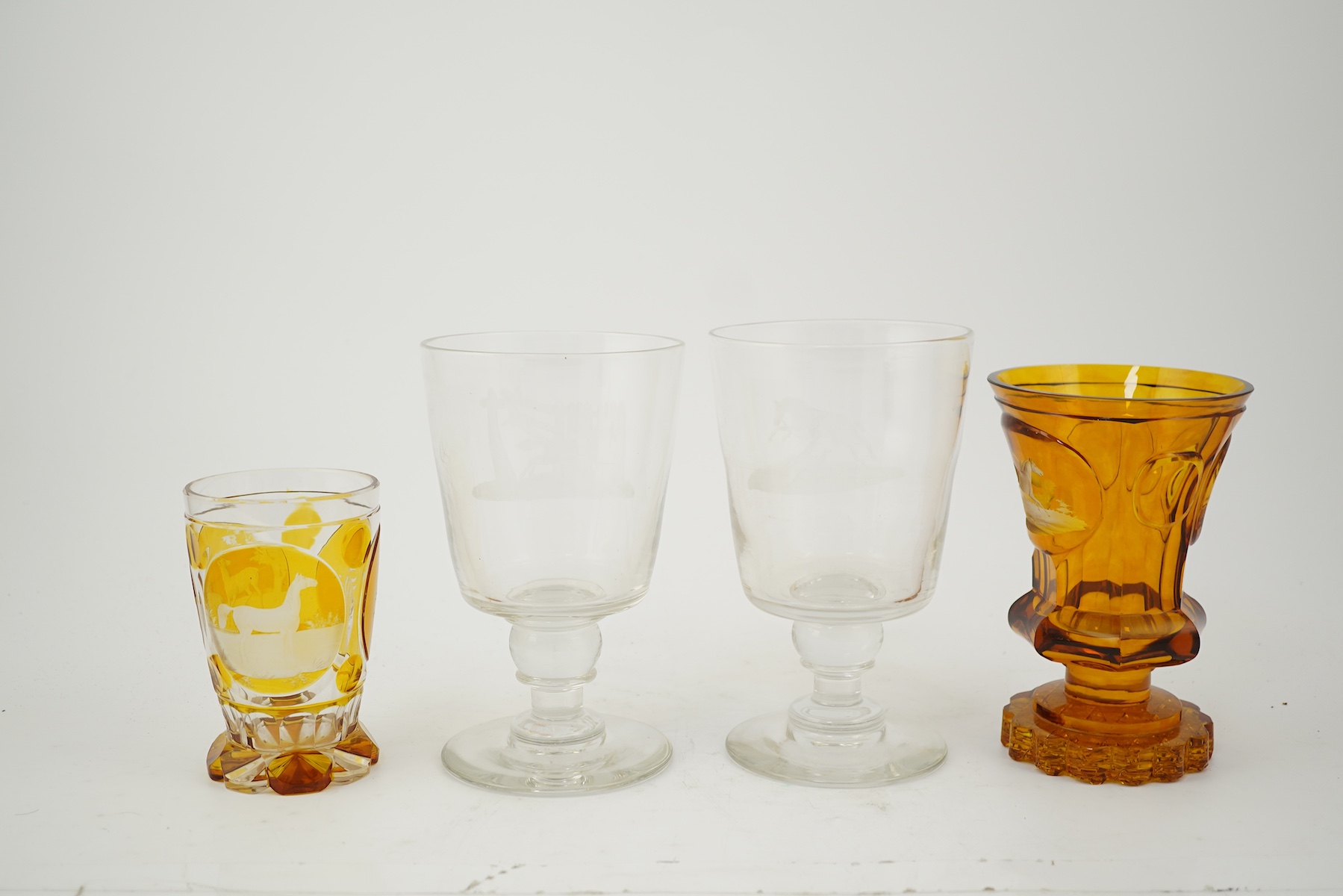 Horse interest - two German amber flashed beakers and two engraved rummers, 19th century